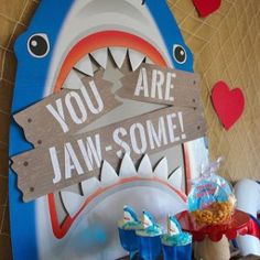 there is a sign that says you are jaws - some on the wall next to cupcakes