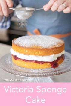 a person is spreading icing onto a cake on a plate with the words victoria sponge cake