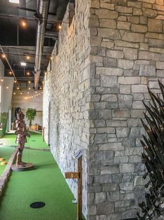 an indoor miniature golf course with a game of throne