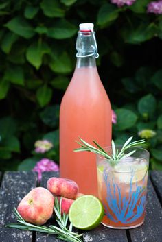 a bottle of water and some fruit on a table