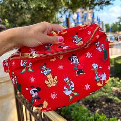 Celebrate the season with the perfect blend of Disney magic and holiday cheer! This Disney Parks-themed Christmas fanny pack is designed for festive fun, whether you're visiting the parks or enjoying holiday outings. Keep all your essentials organized and hands-free while showing off your love for Disney during the most magical time of the year. 🎄✨