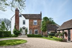 a large house with a driveway in front of it