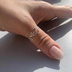 "**Elevate Your Style with Our Silver Leaf Band Thumb Ring 🌿 **Nature-Inspired Beauty This silver leaf band thumb ring draws its inspiration from the beauty of nature. With its delicate leaf design and stackable style, it brings a touch of the outdoors to your everyday look. 💍 **Adjustable for Comfort Crafted for convenience, this cute vine ring ensures a perfect fit on your thumb or any finger. Its adaptability allows you to stack it with other rings or wear it solo, expressing your love for nature effortlessly. 🎁 **Ideal for Gifting Whether it's a birthday celebration or Christmas, this leaf band ring is a thoughtful and charming choice for her. Its craftsmanship and nature-inspired charm will make any occasion extra special. ⭐ **Why Choose Our Silver Leaf Band Thumb Ring - **Nature's Last Finger Ring Design, Adjustable Dainty Toe Rings For Anniversary, Dainty Hypoallergenic Toe Rings For Anniversary, Gift Hypoallergenic Open Midi Ring, Dainty Open Toe Rings As A Gift, Adjustable Dainty Toe Rings As Gift, Adjustable Dainty Toe Rings For Gift, Tiny Open Midi Rings As A Gift, Tiny Open Midi Rings As Gift