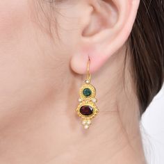 Emerald,Garnet & Pearl Vermeil 14K Gold Over Sterling Silver Earring 925 Silver = 4.85 gm. Emerald,Garnet & Pearl = 4.10 ct. Emerald is the birthstone for May and is a symbol of rebirth and love. Garnet is the birthstone for January and is a symbol of friendship. Pearl is the birthstone for June and is a symbol of good fortune and strength. The beautiful earring measures to be 1.50 inches long including the wire and 0.50 inches wide at its maximum points. The earrings have been made by a Gold Multi-stone Earrings For Gift, Gold Multi-stone Earrings As Gift, Gold Oval Multi-stone Earrings, Gold-plated Multi-stone Earrings, Oval Gold Multi-stone Earrings, Friendship Symbols, Good Fortune, Silver Earring, Beautiful Earrings