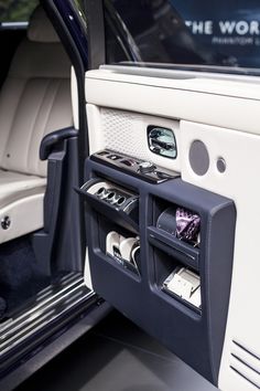 the inside of a car with its door open and various items in it's compartment