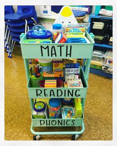 a green cart filled with books and toys