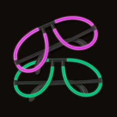 two neon glasses sitting next to each other on a black surface with one glowing green and the other pink