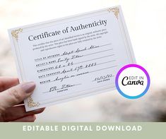 a person holding up a certificate in their hand with the words certificate of authenticity on it