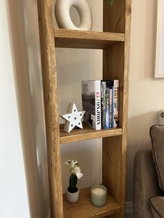 a wooden shelf with books and other items on it