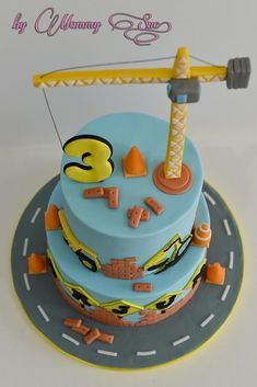 a blue cake with yellow and orange decorations