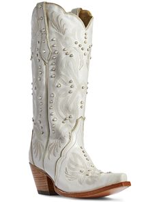 a pair of white cowboy boots with pearls