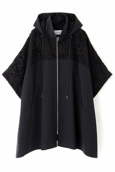 a black jacket with an open hood and lace detailing on the sleeves, in front of a