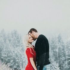 a man and woman kissing in front of snow covered trees with text that reads, i liked by chrystalheatroid, cameraphoto and 479 others