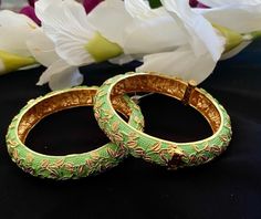 Mint Kundan bangles Gorgeous high-end Bangles, Contemprory ( sold as a pair) Highest quality and craftsmanship, Ready to ship from Edison NJ USA To measure the size of the bangle: Please check the pics for size guide Hold your hand as if you were putting on a bangle. Bring all of your fingers together with your thumb and little finger touching. Measure around the hand at the widest point with a tape measure or a strip of paper. Be sure to pull the paper or tape measure snug against your skin. Ma Green Bangle With Zari Work, Traditional Green Bangle With Zari Work, Green Zari Work Bangle Bracelet, Handmade Green Bollywood Bracelets, Traditional Green Bracelets With Zari Work, Festive Green Meenakari Bangle, Wedding Green Bangle With Zari Work, Green Kundan Bangle In Temple Jewelry Style, Green Kundan Bangle For Ceremonial Occasions