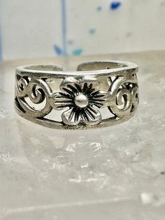 Toe ring flower floral scrollwork band size 3.50 sterling silver women  Size 3.50 adjustable Weight.   1.9g Width        1/4" Thinnest part  of band in back   3/16" Free Shipping & Free Postal Insurance  Delivered in a Gift Box  Let me know if you prefer the ring polished ... otherwise I wont as some people prefer patina .Will include a mini polishing cloth  Free First Class shipping and postal insurance is included. If you want to upgrade to priority kindly pay an additional fee to do so.  This Adjustable Flower Promise Ring For Spring, Adjustable Flower Ring For Spring Anniversary, Adjustable Sterling Silver Ring For Spring, Spring Anniversary Adjustable Flower Ring, Adjustable Nickel-free Flower Promise Ring, Adjustable Nickel-free Flower Ring For Promise, Vintage Silver Toe Ring With Flower Design, Adjustable Sterling Silver Flower Ring, Silver Promise Rings For Spring