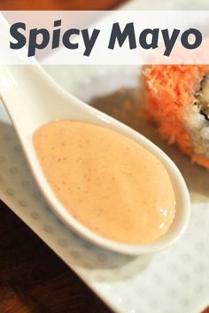 a plate with sushi and dipping sauce on it that says spicy mayo in the middle