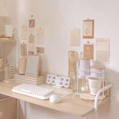 a desk with a keyboard, mouse and other items on it