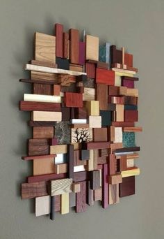 a wall sculpture made out of wood pieces