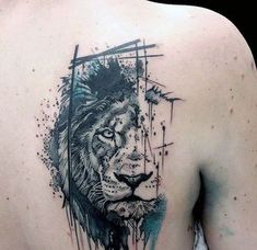 a man's back with a lion tattoo on his left shoulder and an arrow in the center