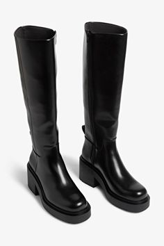 Chunky heeled black faux leather knee-high boots - Black - Monki WW Chunky Black Boots Heels, Black Chunky Leather Boots, Knee High Leather Black Boots, Leather Knee High Lug Sole Boots, Chunky Heel Knee Boots, Shop Knee High Black Boots, Knee High Lugged Boots, Chunky Heal Black Boots, Chunky Heel Fall Boots