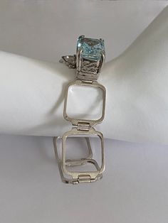 Unique Sterling Silver Open Square Link Bracelet with Center High Profile, Prong Set, Blue Emerald Cut Stone, Open Work Basket Setting Vintage Sterling Silver Jewelry, Blue Emerald, Basket Setting, Emerald Cut, Silver Bracelets, Sterling Silver Bracelets, Vintage Sterling Silver, Link Bracelets, Vintage Finds