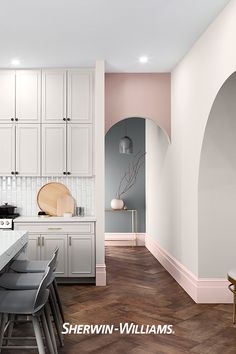 the kitchen is clean and ready to be used for cooking or baking, while the dining room has been painted pink