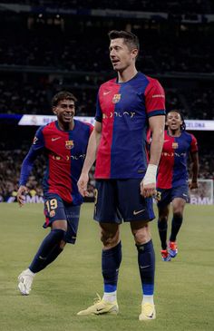 two soccer players are standing on the field