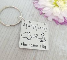 a keychain that says, always under the same sky