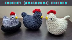 three crocheted chickens sitting on top of a wooden table next to each other