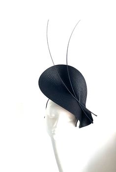 Black Feather Saucer Disc Hat This lovely black Feather Saucer Disc will be perfect for royal ascot and Kentucky derby.  Black Feather Saucer Disc Hat will be an amazing accessory to compliment your outfit. It's elegant and simple. Black Feather saucer disc hat will fit the average head size. Its made from silk covered metal headband attached to the black saucer base on which sits two feathers. To secure your fascinator there is a comb inside the hat attached to the headband, so the fascinator s Black Fitted Fascinator For Evening, Fitted Black Fascinator For Evening, Fitted Black Top Hat With High Crown, Fitted Black Hat For Royal Ascot, Formal Black Costume Hats With Curved Brim, Black Costume Hats For Royal Ascot Party, Elegant Black Fascinator For Evening, Black Formal Costume Hat With Curved Brim, Fitted Black Costume Hat For Royal Ascot