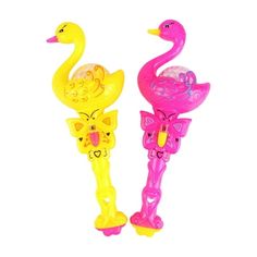 two plastic toys that look like flamingos, one is pink and the other is yellow