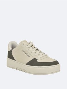 Adorned with subtle colorblock styling, this signature sneaker is crafted from faux leather with faux suede accents. Finished with a CK logo at the side and back heel, a padded logo footbed and a supportive rubber heel.  Material: 100% Sn Pu Suede. Ck Logo, Rubber Heels, Mens Shoes Sneakers, Faux Suede, Color Blocking, Calvin Klein, Men's Shoes, Shoes Sneakers, Faux Leather