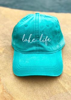 Great for a day in the sun or a day out on the lake! HAT INFORMATION: -Embroidered -6 Panel -Enzyme Washed -Heavy Construction Stitch on Crown and Visor -Pigment Dyed Cotton Twill -Pre-Curved Visor -Tuck Strap with Slide Closure -Unstructured ALL SALES FINAL! All orders within US will ship via USPS first class with tracking to arrive within 5-8 business days depending on your location. Spring Vacation Cotton Baseball Cap, Beach Green Cotton Baseball Cap, Green Cotton Baseball Cap For Beach, Spring Outdoor Hat With Embroidered Logo, Summer Embroidered Green Hat, Green Embroidered Summer Hat, Green Baseball Cap With Embroidered Logo For Summer, Embroidered Hat, Embroidered Hats