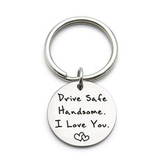 a metal keychain that says drive safe handsome i love you