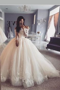 a woman is taking a selfie in her wedding dress while standing in front of a mirror