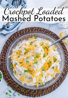 a bowl filled with mashed potatoes on top of a table