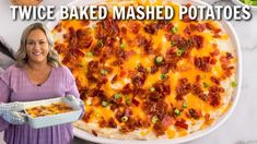 a woman holding a plate with baked mashed potatoes in it and the words twice baked mashed potatoes