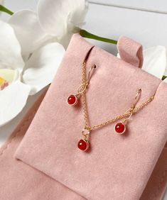 This beautifully simple necklace and earring set is lovingly handmade with tiny Carnelian gemstones and a choice of 14k Gold Filled, 14k Rose Gold Filled or Sterling Silver Chain. M A T E R I A L S: * Carnelian * 14k Gold Filled, 14k Rose Gold Filled or Sterling Silver Chain S I Z E: *  Gemstones - Approximately 4mm *  Chain Thickness - Approximately 1.1mm  All of our jewellery is carefully handmade using good quality materials and handpicked gemstones, with the aim to produce quality pieces that you can love & wear for years to come.  C A R N E L I A N: * July Birthstone * Talisman for Taurus, Cancer, Leo, Virgo * Sacral Chakra, Base Chakra A stabilising stone, Carnelian restores vitality and motivation, and stimulates creativity.  It gives courage, promotes positive life choices, dispels Gold Carnelian Jewelry With Matching Earrings, Carnelian Dangle Jewelry With Matching Earrings, Carnelian Drop Earrings Jewelry Gift, Dainty Necklaces With Matching Dangle Earrings, Dainty Carnelian Gemstone Jewelry, Dainty Jewelry Sets With Matching Earrings As Gift, Dainty Jewelry Sets As A Gift, Jewelry Sets With Dangle Earrings As A Gift, Delicate Jewelry Sets With Matching Earrings As Gift