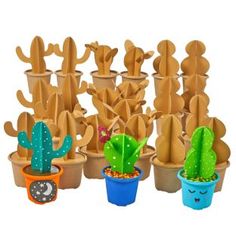 a group of clay cactus planters sitting next to each other