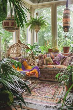 a living room filled with lots of plants and wicker furniture on top of a rug