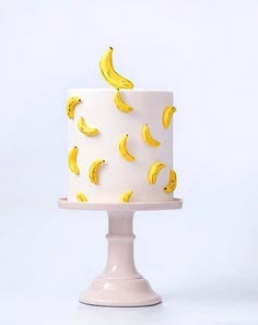 there is a white cake with bananas on it