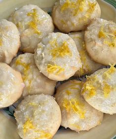 a white plate topped with lemon cookies on top of a table