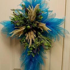 a blue wreath hanging on the front door