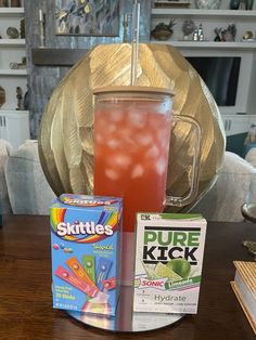 the drink is on the table next to some cards and other items for making drinks