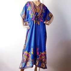 New With Tags. Beautiful African Dashiki Caftan. Lightweight Maxi Caftan Dress. Multicolored, With Blue, Hot Pink, White, Mustard Yellow & Black. Beautiful Array Of Floral, Geometric, & African Prints. Adjustable Drawstrings At The Waist. Slits On The Lower Sides, V-Neck Collar, Very Flowy And Non Stretch. One Size. 100% Viscose *A Number Of Small (Normal) Imperfections Are Shown In The Last Closeup Pics. Please Read And Examine Them. Length=52" Across=35.5" Blue Short Sleeve Kaftan For Vacation, Royal Blue Bohemian Summer Dress, Blue Bohemian Dress With Vibrant Print, Bohemian Blue Dress With Vibrant Print, Bohemian Blue Dresses With Vibrant Print, Multicolor Bohemian Maxi Dress For Navratri, Blue Bohemian Kaftan For Summer, Blue Long Boho Print Dress, Blue Long Dress With Boho Print