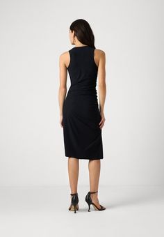 This jersey dress characterized by essential lines features a distinctive asymmetrical neckline that gives the garment a modern and seductive allure. Close-fitting with split opening and length at the knee. Technical stretch jersey Close-fitting Length below the knee The model is 1.76 m tall and wearing a size 40/XS/0 (IT) 2A2788-JZ26 Jumpsuit Jeans, Asymmetrical Neckline, Blouse Pants, Knit Vest, Shop Swimwear, Blazer Dress, Jersey Dress, Jeans Dress, Dress P