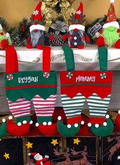 christmas stockings hanging from a fireplace mantel