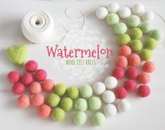 wool felt balls are arranged in a circle with the words watermelon on it