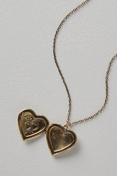 A super sweet gift or an accessory unique to you, this darling monogram necklace features a heart locket pendant with an initial engraving. **Features:** Dainty chain, heart locket pendant, hinge opening mechanism, monogram initial engraving, clasp closure **Why We | Monogram Necklace by Free People in Gold Wedding Heart Pendant Locket Necklace With Charms, Vintage Charm Heart Pendant Jewelry For Keepsake, Vintage Heart Pendant Charm Jewelry For Keepsake, Vintage Charm Pendant Jewelry For Anniversary Gift, Vintage Pendant Jewelry For Anniversary Gift, Wedding Locket Necklace With Charms For Valentine's Day, Anniversary Gift Pendant Jewelry With Vintage Charm, Valentine's Day Wedding Locket Necklace With Charms, Vintage Charm Heart Pendant Necklace For Wedding