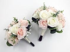 two bridal bouquets with pink and white flowers